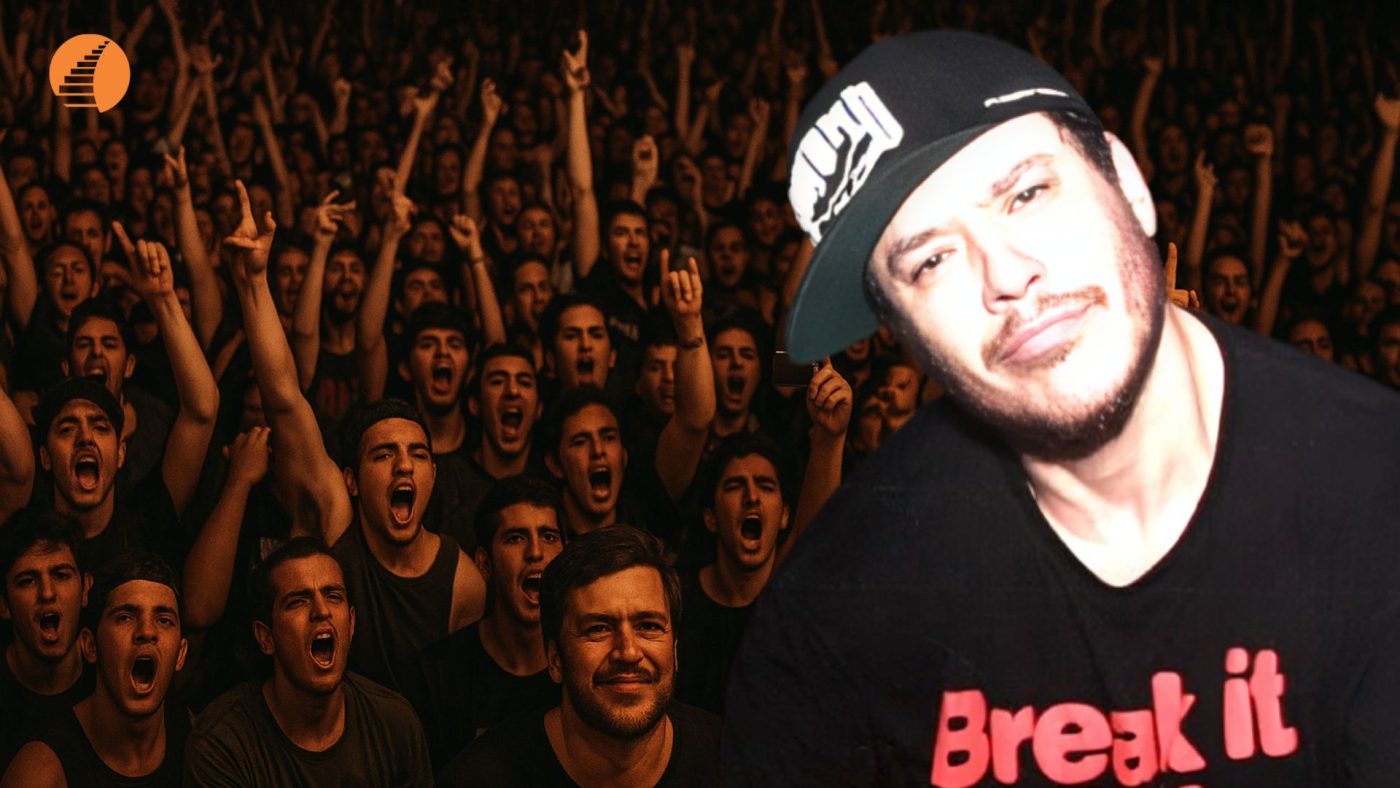 Homem com boné e camiseta "Break it" sobreposto a uma multidão de fãs empolgados em um show ao vivo.
